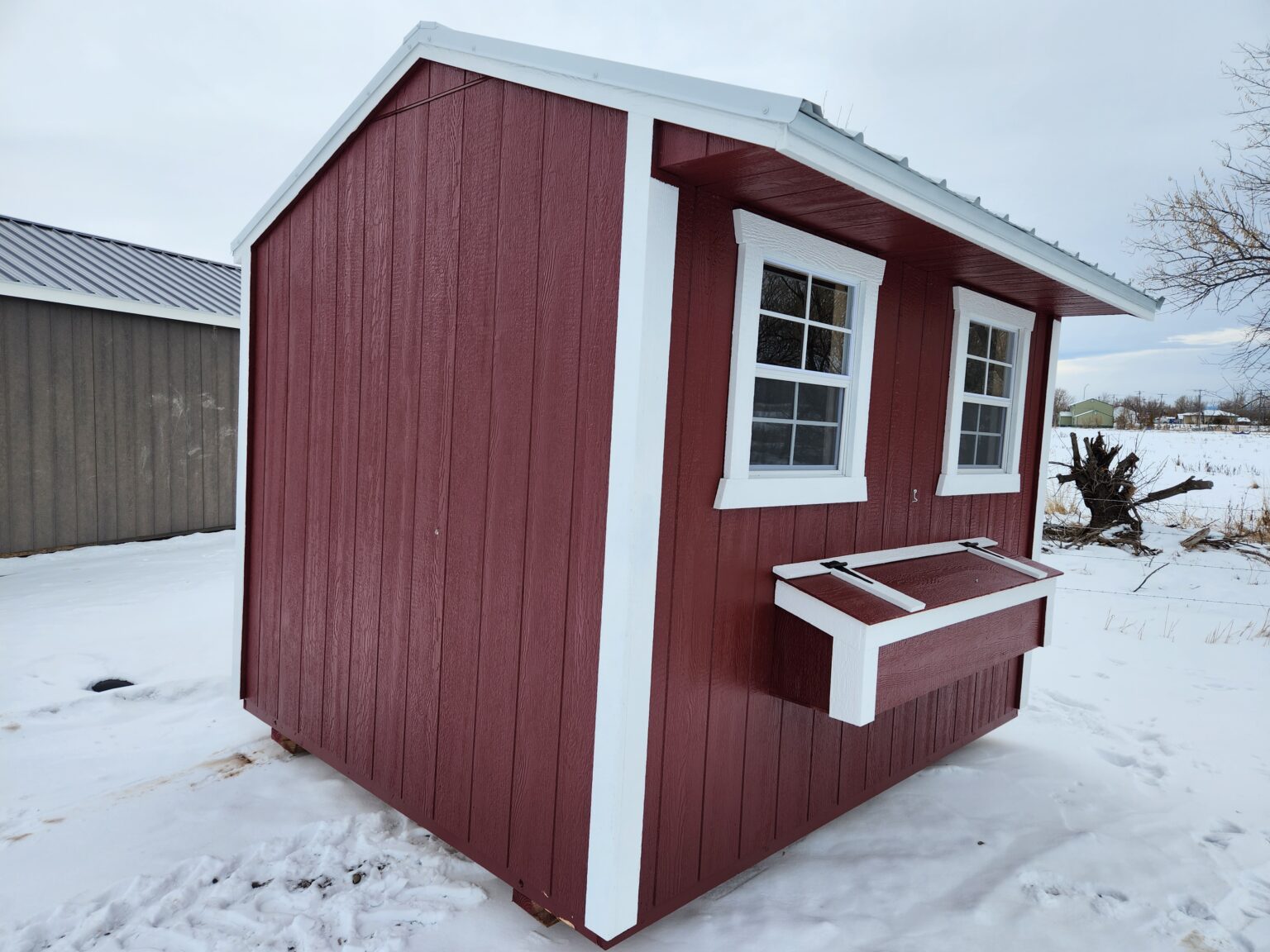 Red and white 8x10 chicken coop.