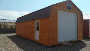 Log sided 16x32 garage with green roof.