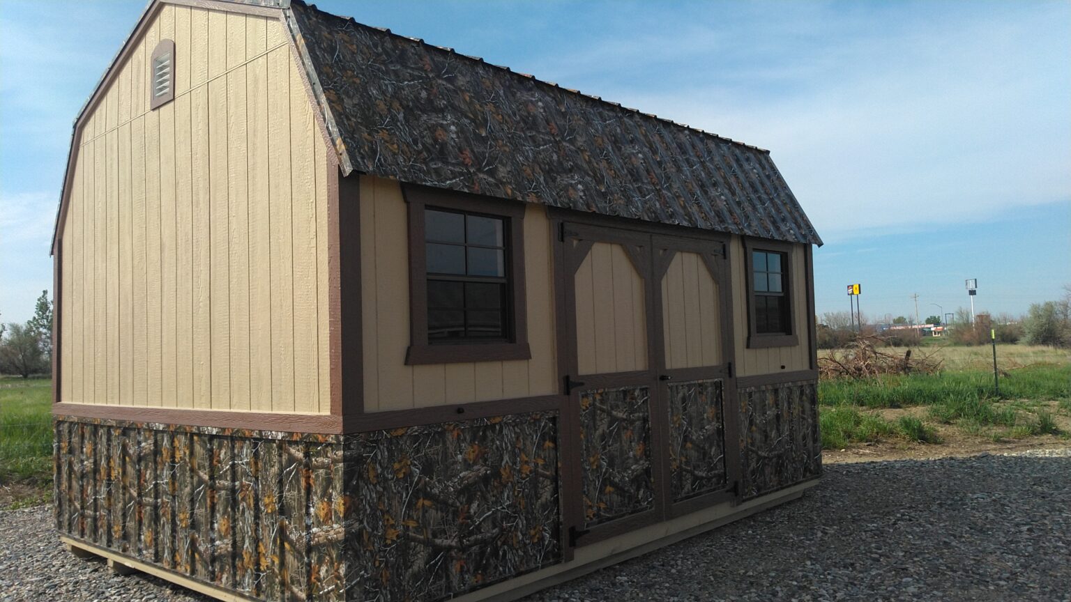 Tan, camo, dark brown 12x16 barn with 2 windows and loft.