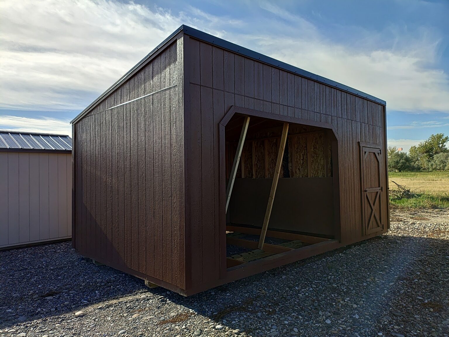 Brown 12x20 horse shelter with tackroom.